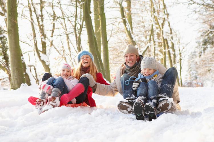 family having fun in the snow